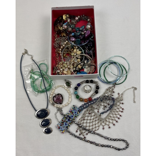 1083 - A box of modern costume jewellery. To include glass bead necklaces in various styles and colours, a ... 