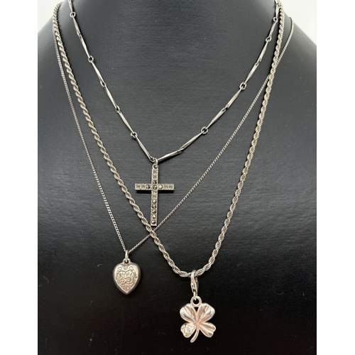 1086 - 3 silver pendant necklaces. A plain cross on a 16