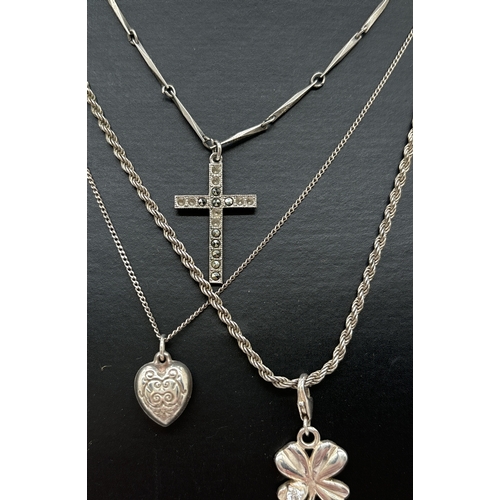 1086 - 3 silver pendant necklaces. A plain cross on a 16