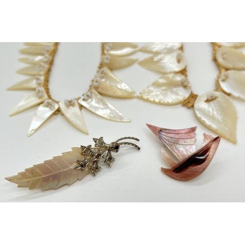 1096 - 4 pieces of vintage carved mother of pearl jewellery. A leaf brooch, a 16