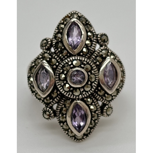 1120 - A silver Gothic style statement ring set with marquise and round cut amethysts and multiple marcasit... 