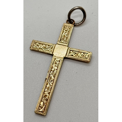 1101 - A vintage 9ct gold on silver cross pendant with engraved design to front. 9ct and silver mark to bac... 