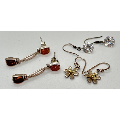 1126 - 3 pairs of silver drop style earrings. A pair of modern design set with oblong cut honey and cognac ... 