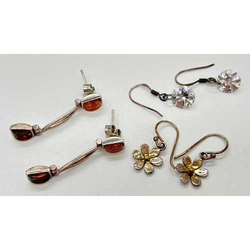 1126 - 3 pairs of silver drop style earrings. A pair of modern design set with oblong cut honey and cognac ... 