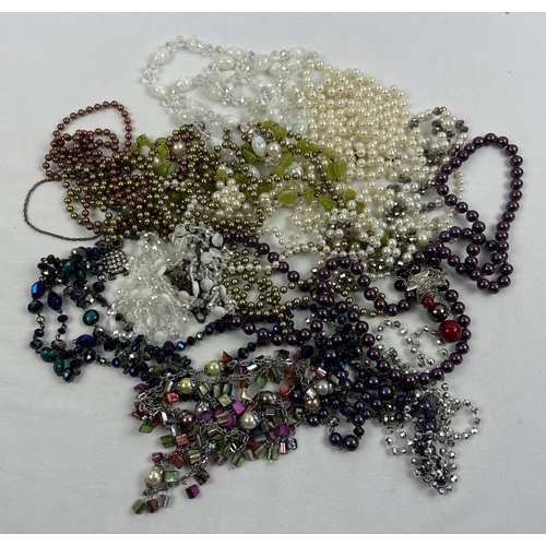 1134 - A collection of vintage bead necklaces to include glass, faux pearl and coloured shell. In various d... 