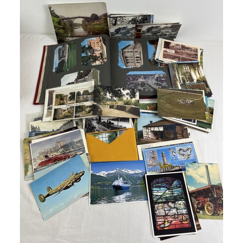 273 - A vintage postcard album of coloured postcards together with a box of assorted vintage & modern post... 