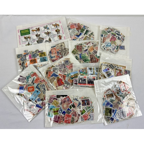 93 - 12 assorted packets of vintage British and world franked stamps.