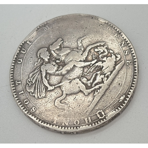 3 - A 1818 George III silver crown showing George Slaying the Dragon on reverse. Small areas of general ... 