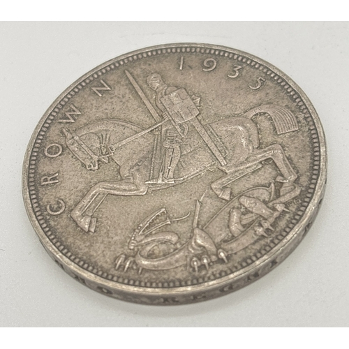 7 - A .500 silver 1935 George V silver jubilee crown with Art Deco George and dragon (rocking horse) to ... 