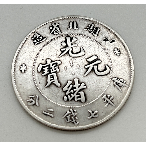 13 - A Chinese silver Hu-Peh Province 7 Mace and 2 Candareens coin. Weighs approx. 26.78g and measures 3.... 