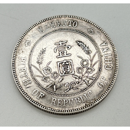 14 - A Chinese silver 1 yuan/dollar Memento: Birth of Republic of China commemorative coin. Featuring the... 