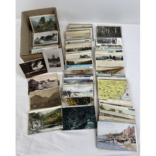 242 - 400 assorted black & white and coloured vintage British postcards to include RP's. In a brown card l... 