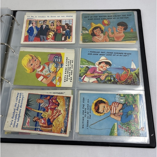 243 - A large postcard album containing approx. 240 assorted vintage humorous postcards, in clear plastic ... 