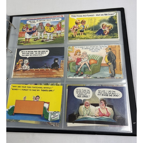 243 - A large postcard album containing approx. 240 assorted vintage humorous postcards, in clear plastic ... 