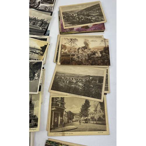 244 - 300 assorted Victorian & vintage overseas postcards, to include RP's, from various European & worldw... 