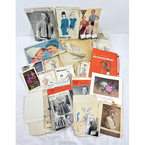 116 - A collection of assorted vintage 1950's ephemera to include knitting & dressmaking patterns, greetin... 