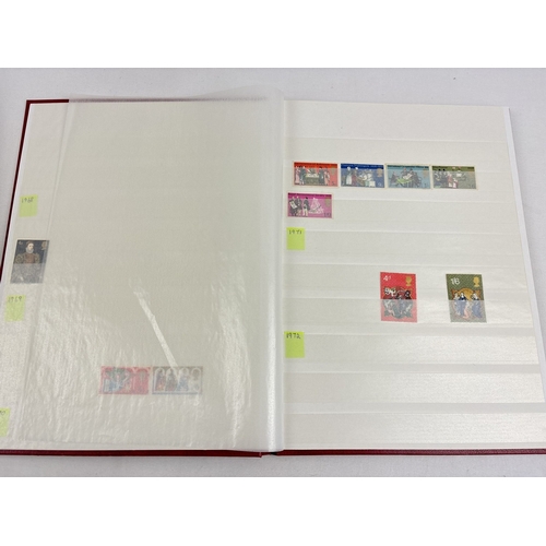 67 - A red Wessex Knight stamp album and a black Barclay Classic Stamp Album. Both containing a small amo... 