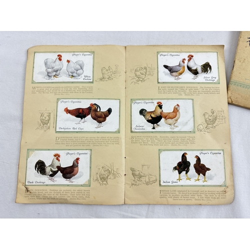 127 - 11 vintage Will's cigarette card albums with cards, together with John Players cigarette card albums... 