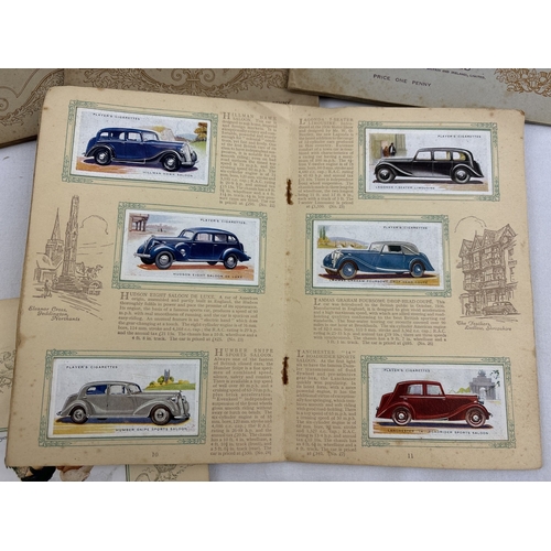 127 - 11 vintage Will's cigarette card albums with cards, together with John Players cigarette card albums... 