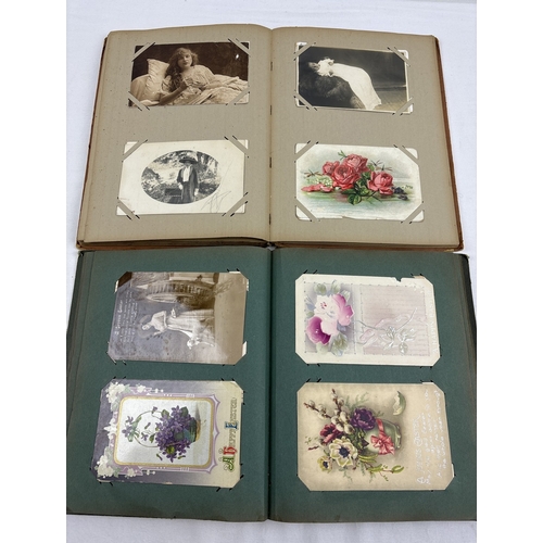 255 - 2 Edwardian postcard albums containing 175 assorted postcards, greetings cards and sweetheart cards.