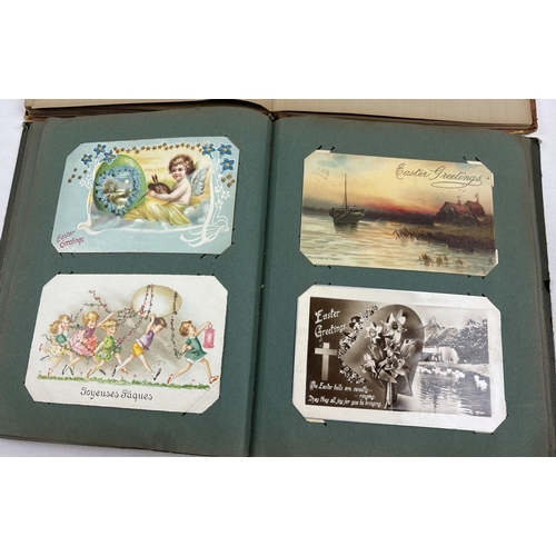 255 - 2 Edwardian postcard albums containing 175 assorted postcards, greetings cards and sweetheart cards.