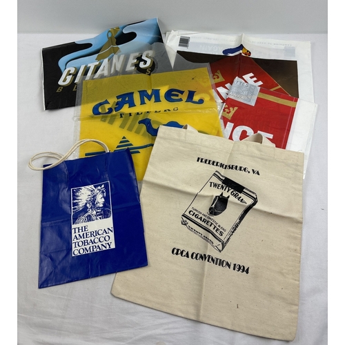 178 - A box of assorted vintage cigarette advertising and ephemera. To include posters, bags and pages fro... 