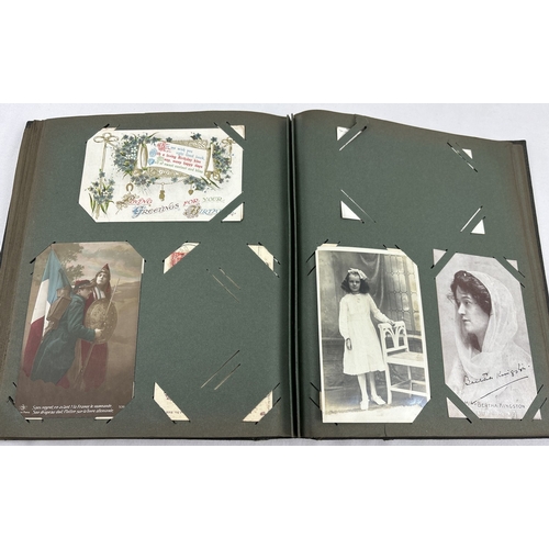 184 - A late Victorian postcard album containing 130 assorted postcards and greetings cards. To include Br... 