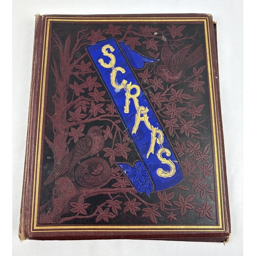 188 - A Victorian burgundy coloured scrap album with bird design to front and gilt lettering. Containing a... 