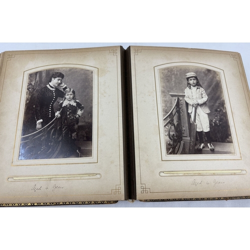 190 - A Victorian leather bound photograph album containing cabinet cards of Allan James Crawford Farie th... 