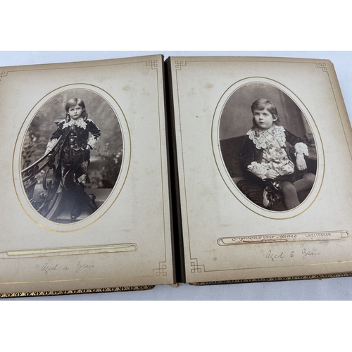 190 - A Victorian leather bound photograph album containing cabinet cards of Allan James Crawford Farie th... 