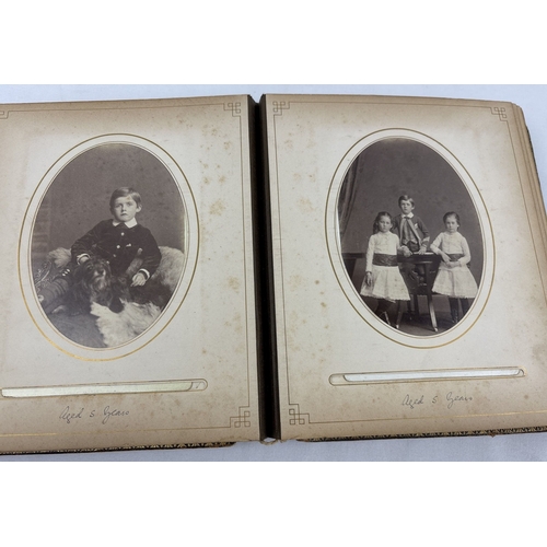 190 - A Victorian leather bound photograph album containing cabinet cards of Allan James Crawford Farie th... 