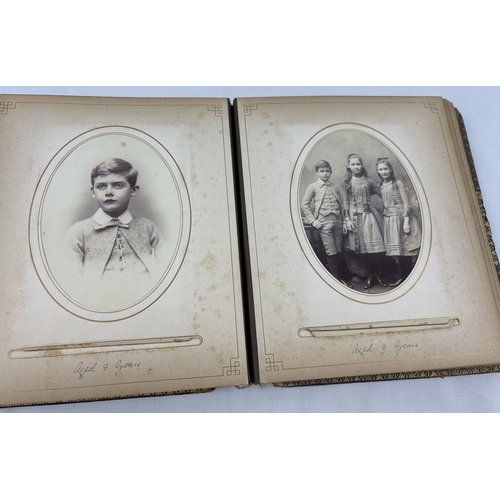 190 - A Victorian leather bound photograph album containing cabinet cards of Allan James Crawford Farie th... 