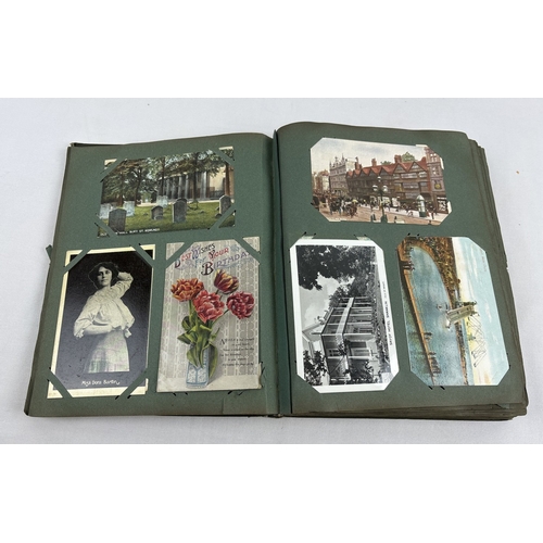 259 - An early 20th century postcard album containing 330 assorted greetings cards and British postcards, ... 