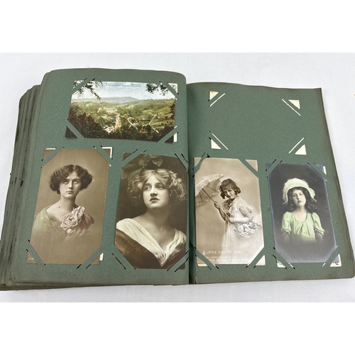 259 - An early 20th century postcard album containing 330 assorted greetings cards and British postcards, ... 