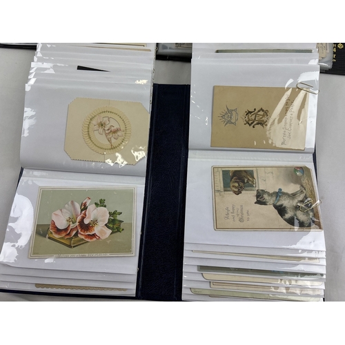 191 - 2 albums containing 180+ assorted Edwardian and vintage greetings cards, in varying sizes and design... 