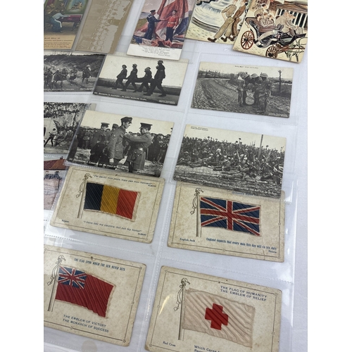 262 - A collection of 30 assorted early 20th century military related postcards, in clear plastic display ... 