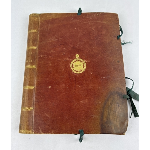 204 - A leather bound tie up folder containing assorted loose scrap book pages. Pages are highly decorated... 