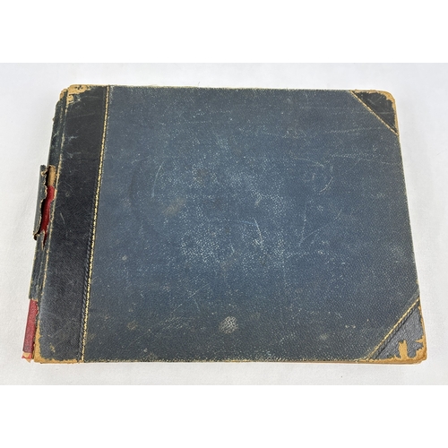 209 - A Victorian scrap album with leather bound spine and corners (some damage) containing assorted plait... 