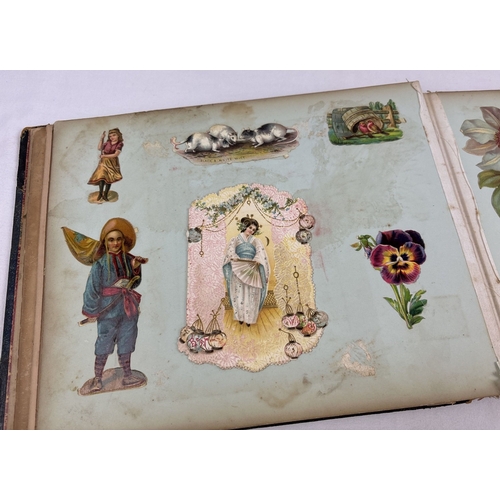 209 - A Victorian scrap album with leather bound spine and corners (some damage) containing assorted plait... 