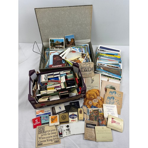 105 - A collection of assorted vintage ephemera to include advertising matchbook collection, postcards, be... 