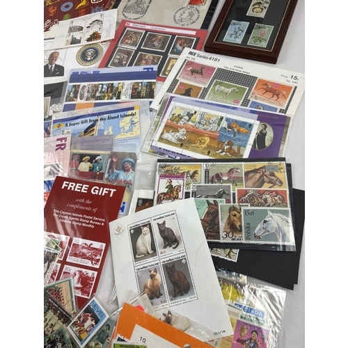 49 - A box of British and foreign stamp sets, panes and blocks of stamps. To include USA Rosa Parks self ... 