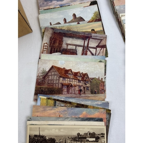 241 - 400 assorted black & white and coloured vintage British postcards to include RP's. In a brown card l... 