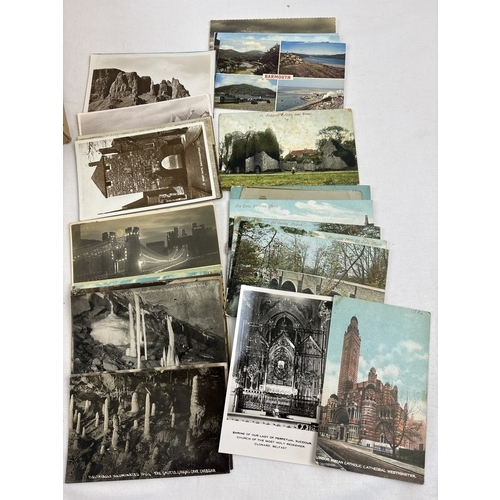 242 - 400 assorted black & white and coloured vintage British postcards to include RP's. In a brown card l... 