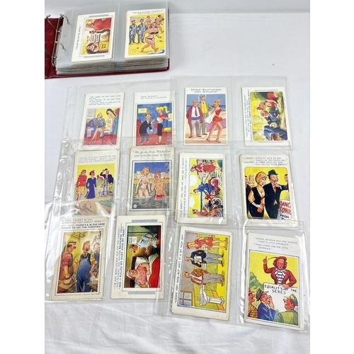 254 - An album of 160 assorted vintage humorous/saucy postcards to include Bamforth's Comic series, Coasta... 