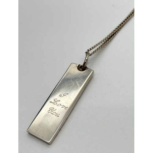 1003 - A vintage silver ingot pendant with large hallmarks to front and engraved 