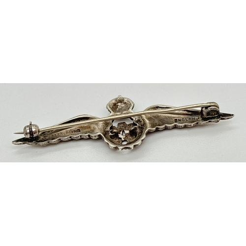 1034 - A vintage silver RAF wings sweetheart brooch set with blue enamel and marcasite stones. Silver mark ... 