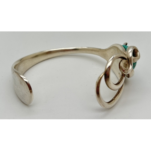 1036 - An unusual costume jewellery open design bangle made from a vintage silver plated fork and set with ... 