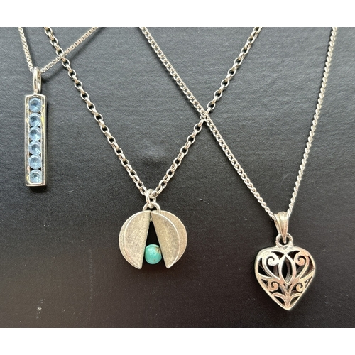 1038 - 3 silver and white metal pendant necklaces. An oblong pendant set with blue stones on an 18