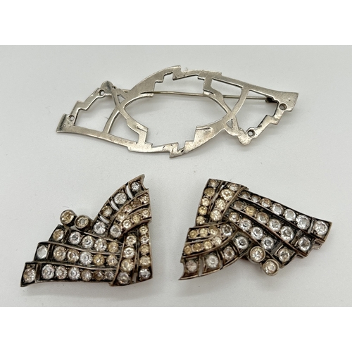 1044 - An art Deco French silver brooch/dress clip in the shape of a bow, set with multiple round cut clear... 