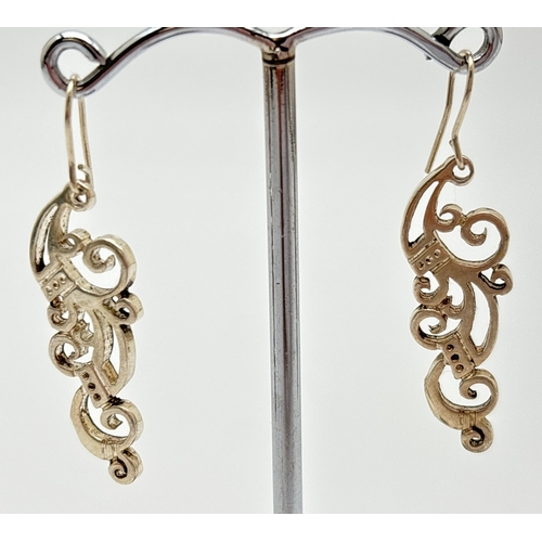 1055 - 2 pairs of Scottish silver pierced work drop earrings by Stewart John Wilson. A pair of double heart... 